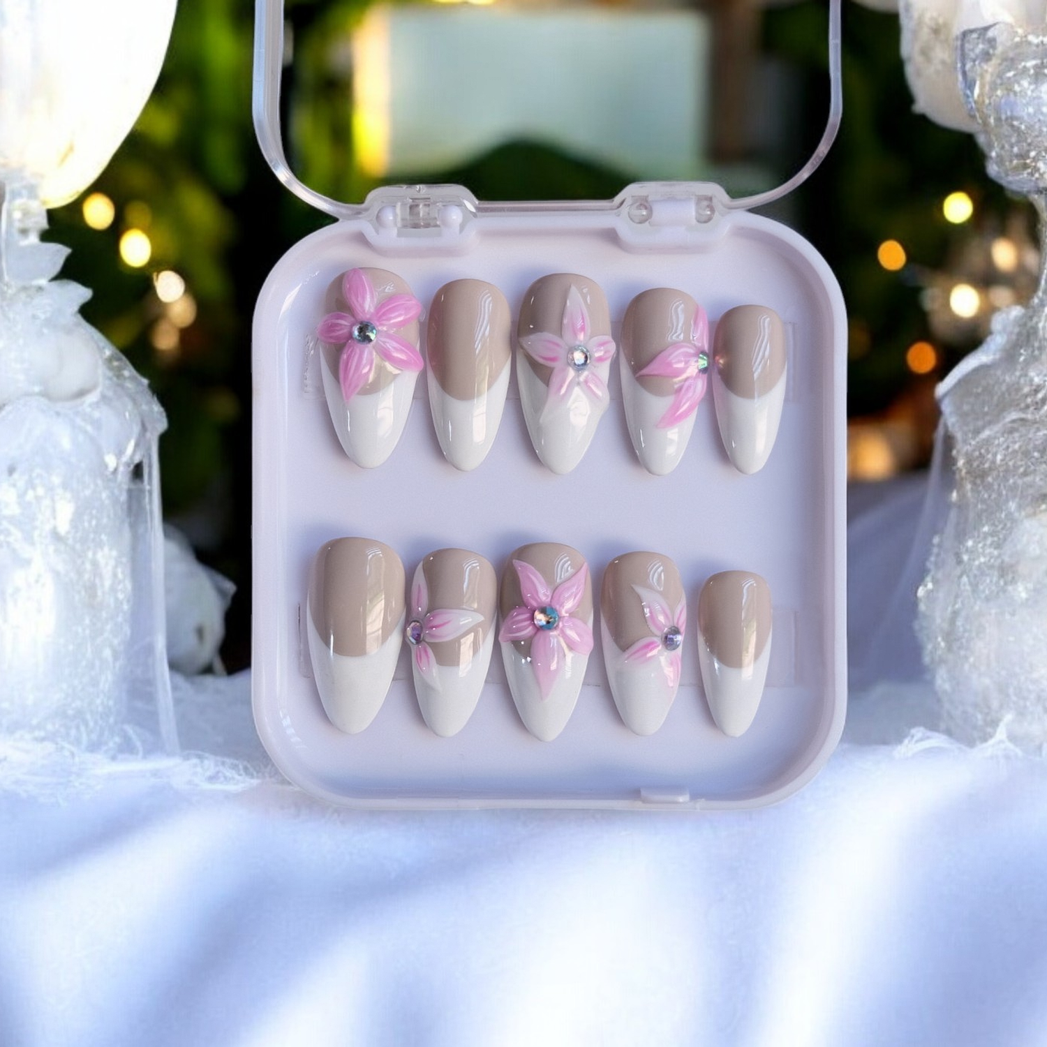 Almond gel nails with French tips and 3D floral design details