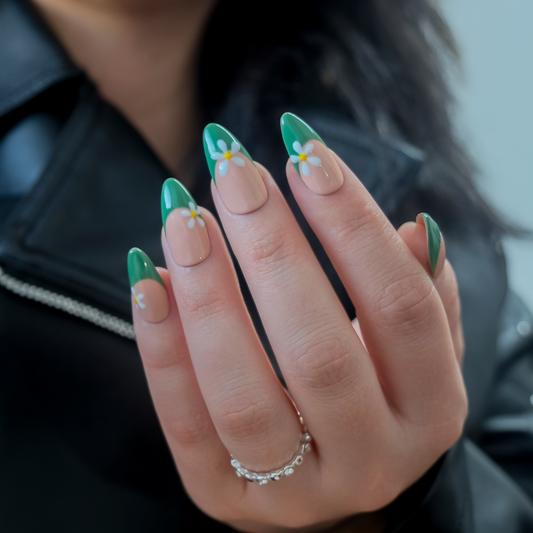 Almond gel nails with green French tips and white daisy design